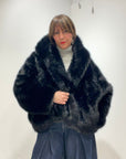 Le streghe - eco pelliccia nera con cappuccio